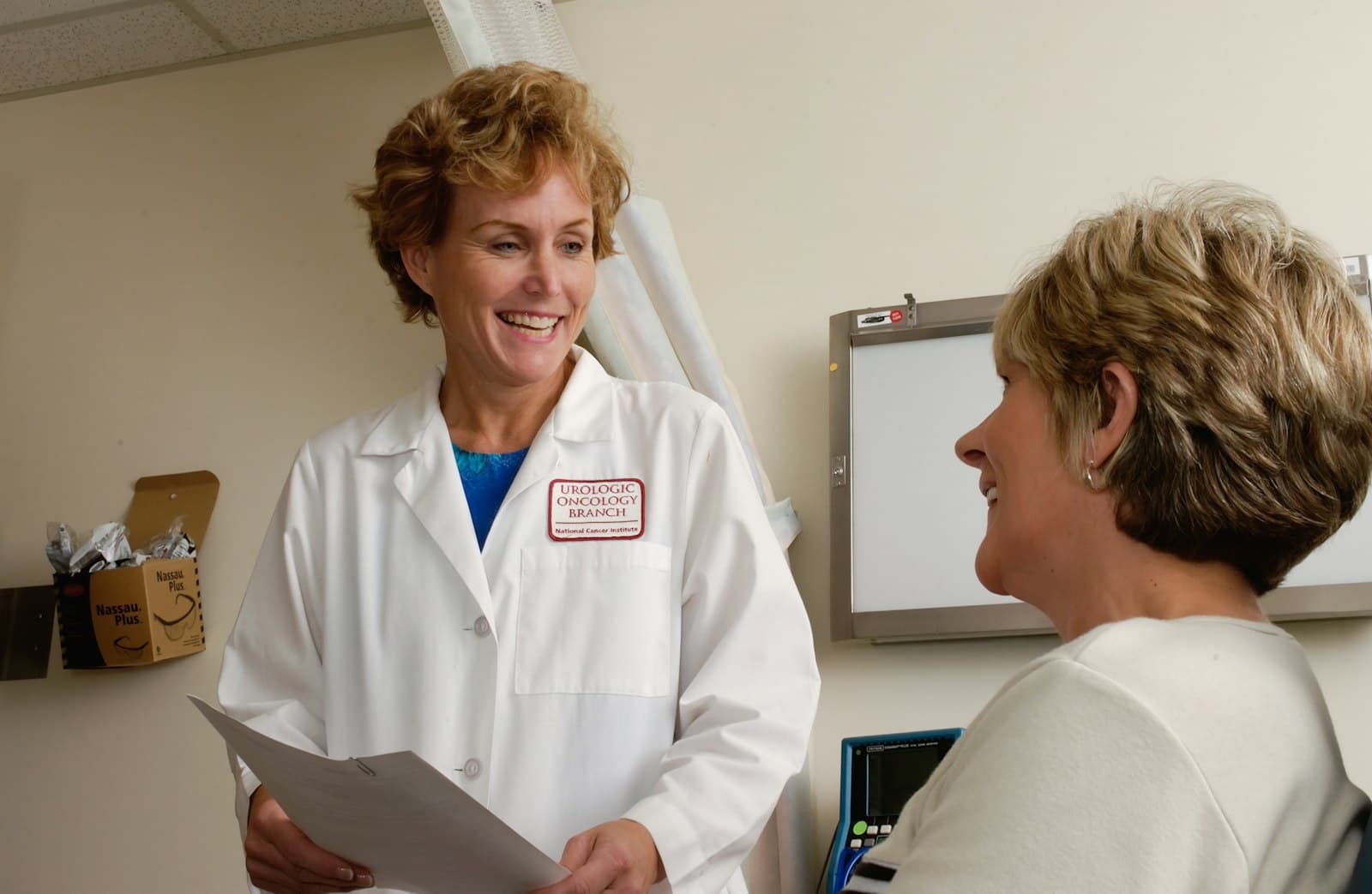 Clinical professional reviewing files on a laptop
