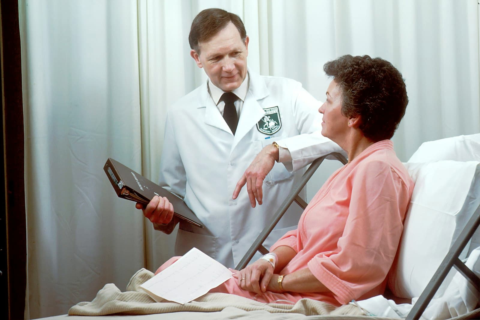 Healthcare provider reviewing notes on a tablet